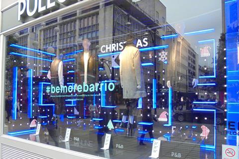 The Pull and Bear Christmas window display uses blue lighting